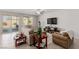 Spacious living room with tile floors and access to backyard at 10440 Irish Cliffs Ct, Las Vegas, NV 89149