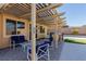 Relaxing patio with seating area and pergola at 10440 Irish Cliffs Ct, Las Vegas, NV 89149