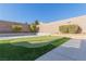 Landscaped backyard putting green at 10440 Irish Cliffs Ct, Las Vegas, NV 89149