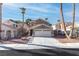 Two-story house with attached garage and desert landscaping at 2825 Autumn Haze Ln, Las Vegas, NV 89117