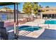 Community pool and spa with lounge chairs at 3151 Soaring Gulls Dr # 2119, Las Vegas, NV 89128