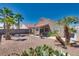 Backyard view showcasing a covered patio and gravel yard at 3706 Rose Canyon Dr, North Las Vegas, NV 89032