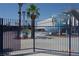 Exterior of the aquatic center with waterslides and recreational facilities, surrounded by palm trees at 4709 W Alpine Pl, Las Vegas, NV 89107