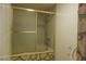 Bathroom featuring tub with shower at 4709 W Alpine Pl, Las Vegas, NV 89107