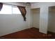 Bedroom with wood floors, curtains, window, and closet at 4709 W Alpine Pl, Las Vegas, NV 89107