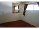 Bedroom with wood floors, neutral walls, window, and a gold mirror at 4709 W Alpine Pl, Las Vegas, NV 89107