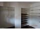 Walk-in closet featuring shelving and open hanging space at 4709 W Alpine Pl, Las Vegas, NV 89107