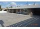 Exterior of home featuring a large driveway and geometric block design elements at 4709 W Alpine Pl, Las Vegas, NV 89107