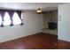 Living room with hardwood floors and stone fireplace at 4709 W Alpine Pl, Las Vegas, NV 89107