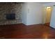 Spacious living room with stone fireplace and access to the bathroom at 4709 W Alpine Pl, Las Vegas, NV 89107