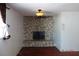 Living room with hardwood floors and stone fireplace at 4709 W Alpine Pl, Las Vegas, NV 89107