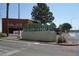 Entrance to Meadows Mall with a modern sign and landscaping, near a retail area at 4709 W Alpine Pl, Las Vegas, NV 89107