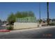 Sign for Meadows Mall set amid desert landscaping, near a commercial area on a sunny day at 4709 W Alpine Pl, Las Vegas, NV 89107