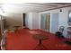 A patio with a red floor and table at 4709 W Alpine Pl, Las Vegas, NV 89107