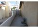 Side yard featuring a metal gate, concrete path, and block walls at 4709 W Alpine Pl, Las Vegas, NV 89107