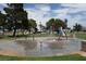 Community splash pad featuring colorful spray features and green common areas on a sunny day at 4709 W Alpine Pl, Las Vegas, NV 89107