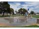 Community splash pad featuring colorful spray features and green common areas on a sunny day at 4709 W Alpine Pl, Las Vegas, NV 89107