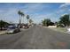Street view of the property with palm trees and parked cars on a sunny day at 4709 W Alpine Pl, Las Vegas, NV 89107