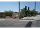 Springs Preserve entrance street view with signage for a Dinosaur Explorer exhibit and lush landscaping at 4709 W Alpine Pl, Las Vegas, NV 89107