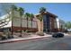 Exterior view of the YMCA showcasing a modern facade and inviting entryway with palm trees at 4709 W Alpine Pl, Las Vegas, NV 89107