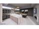 Stylish bar area with marble countertops, ample storage, modern lighting, and entertainment space at 495 Cityview Ridge Dr, Henderson, NV 89012