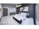 Stylish bedroom featuring neutral color palette, modern lighting, and elegant artwork at 495 Cityview Ridge Dr, Henderson, NV 89012