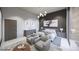 Bedroom featuring a bed with two grey chairs and a side table at 495 Cityview Ridge Dr, Henderson, NV 89012