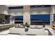Modern living room featuring an open floorplan, large windows with city views, and stylish furniture at 495 Cityview Ridge Dr, Henderson, NV 89012