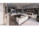 Expansive living room with open layout, stylish decor, contemporary furnishings, and modern kitchen at 495 Cityview Ridge Dr, Henderson, NV 89012