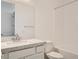 Well-lit bathroom featuring a single vanity and a shower-tub combination at 104 Barkset Way, Henderson, NV 89011