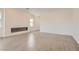 Spacious living room with a modern fireplace and ample space for entertaining at 104 Barkset Way, Henderson, NV 89011