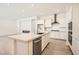 Stylish kitchen island with stone countertops, stainless steel appliances and open floorplan at 106 Barkset Way, Henderson, NV 89011