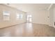 Bright living room featuring wood-look tile floors, recessed lighting and access to the backyard at 106 Barkset Way, Henderson, NV 89011