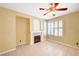 Bright living room with a fireplace, tile flooring, and plantation shutters at 1708 Jack Rabbit Way, Las Vegas, NV 89128