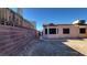 Long narrow backyard with block wall and partial view of house at 1940 Whiton St, Las Vegas, NV 89156