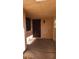 Covered side entrance with a dark brown door and small courtyard at 1940 Whiton St, Las Vegas, NV 89156