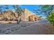 Inviting two-story building with desert landscaping, stone accents, and ample parking spaces at 2020 Rancho Lake Drive Dr # 205, Las Vegas, NV 89108