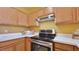 Modern kitchen with stainless steel appliances and wood cabinets at 2020 Rancho Lake Drive Dr # 205, Las Vegas, NV 89108