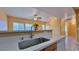 Modern kitchen with stainless steel faucet, dishwasher, and connection to the living area at 2020 Rancho Lake Drive Dr # 205, Las Vegas, NV 89108
