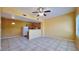 Open-concept living room with tiled floors adjacent to kitchen with ample space at 2020 Rancho Lake Drive Dr # 205, Las Vegas, NV 89108