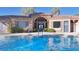 Inviting community pool with clear blue water, tile roofing and pool restroom entrance at 2020 Rancho Lake Drive Dr # 205, Las Vegas, NV 89108