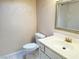 Bathroom with vanity, toilet, and framed mirror at 3719 Colonial Dr, Las Vegas, NV 89121