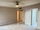 Bright bedroom with tile floors and ceiling fan at 3719 Colonial Dr, Las Vegas, NV 89121