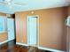 Bedroom with wood floors and access to hallway at 3719 Colonial Dr, Las Vegas, NV 89121