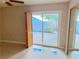 Bedroom with patio access and mirrored closet at 3719 Colonial Dr, Las Vegas, NV 89121