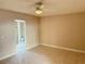 Bedroom with tile floors, ceiling fan and adjacent bathroom at 3719 Colonial Dr, Las Vegas, NV 89121