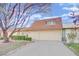 Tan colored exterior, attached garage, and manicured landscaping at 3719 Colonial Dr, Las Vegas, NV 89121