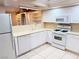 White kitchen with ample cabinetry and a gas range at 3719 Colonial Dr, Las Vegas, NV 89121