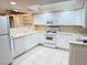 White kitchen with ample cabinetry and a gas range at 3719 Colonial Dr, Las Vegas, NV 89121