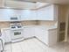 White kitchen with ample cabinetry and a gas range at 3719 Colonial Dr, Las Vegas, NV 89121